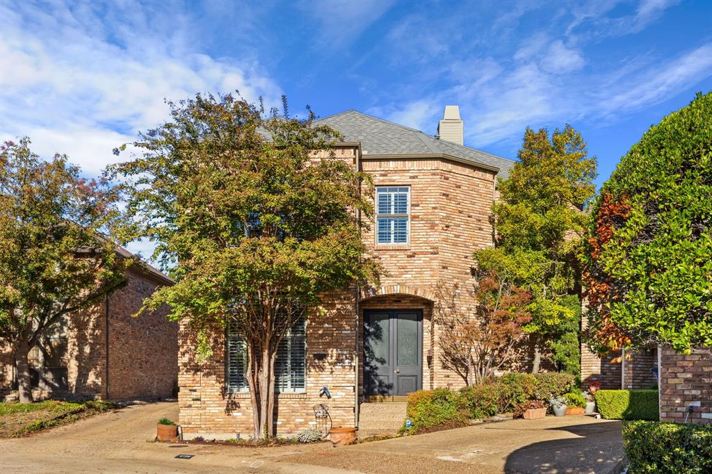 4134 Crossing Lane Dallas, TX 75220 - Photo 1 of 39 View of front of house with brick siding, a chimney, and a shingled roof