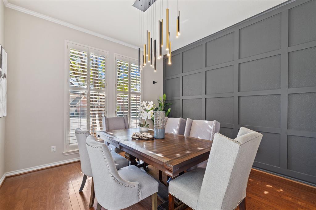 4134 Crossing Lane Dallas, TX 75220 - Photo 3 of 39 Dining space with a decorative wall, ornamental molding, and dark wood-style floors