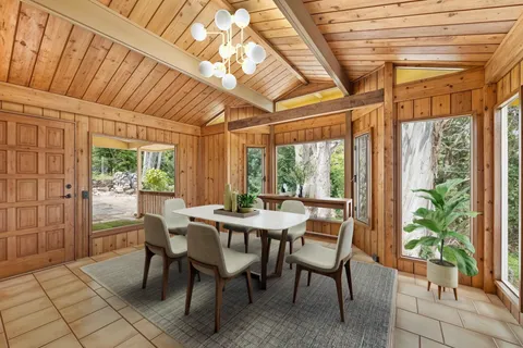 a view of a dining room with furniture window and outside view