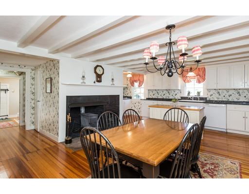 128 Somers Road Hampden, MA 01036 - Photo 17 of 30 a view of a dining room and livingroom with furniture wooden floor a chandelier