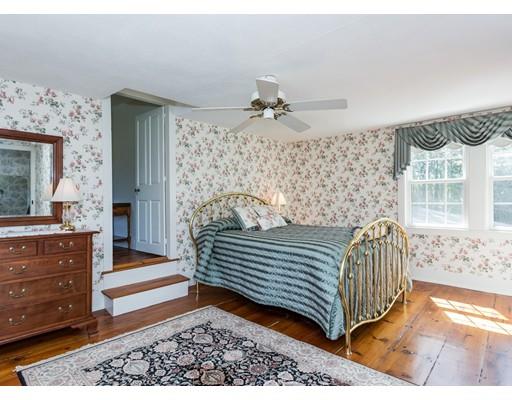 128 Somers Road Hampden, MA 01036 - Photo 26 of 30 a bedroom with a bed and a mirror on the dresser