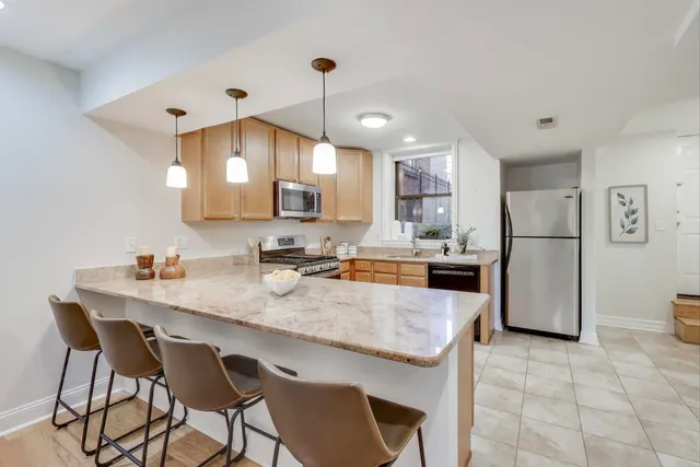 a kitchen with a sink stove and microwave