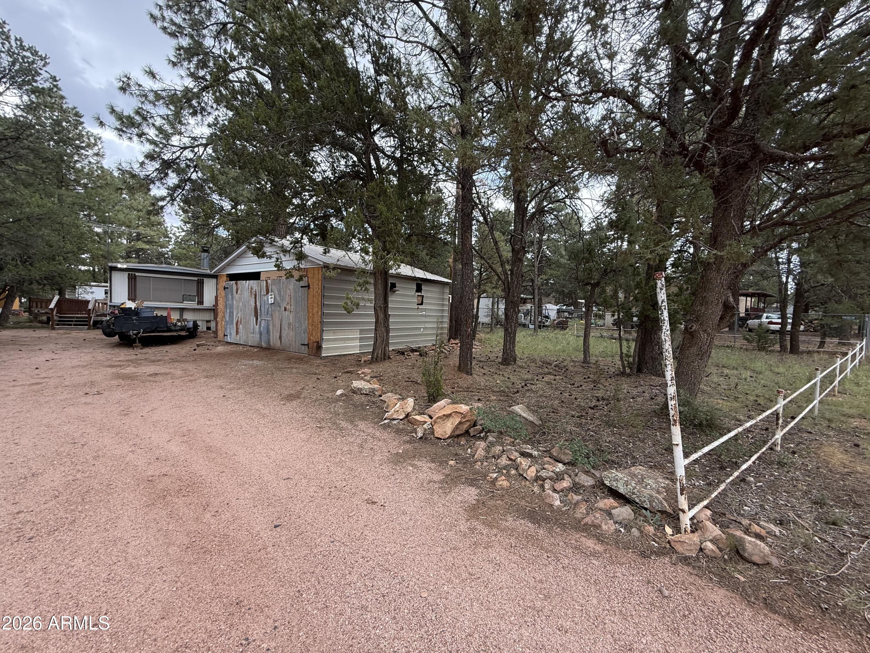2953 Wildcat Trail Overgaard, AZ 85933 - Photo 21 of 22 a view of a yard with large tree
