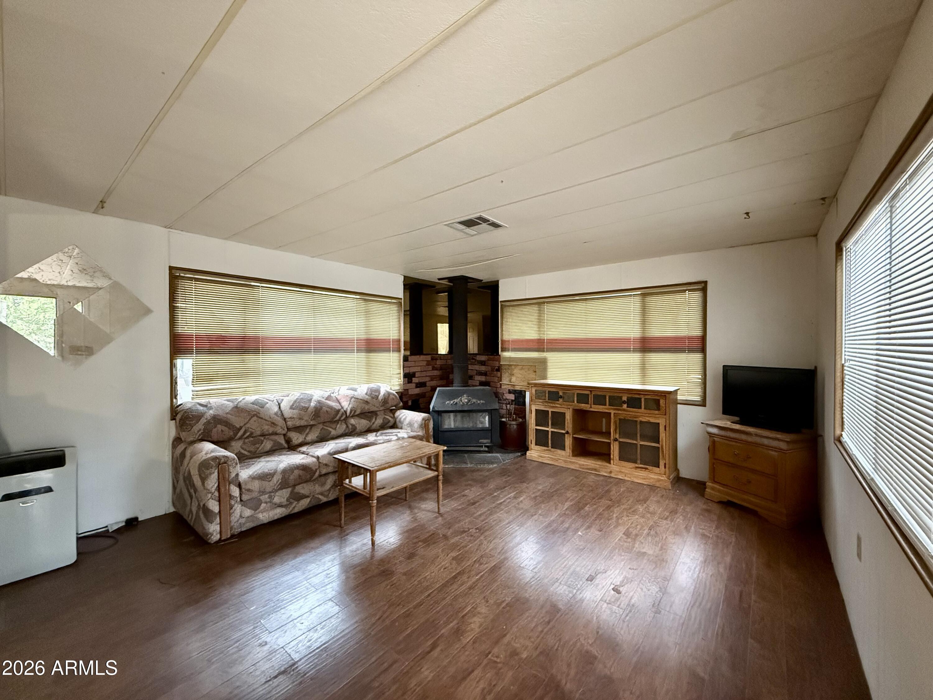 2953 Wildcat Trail Overgaard, AZ 85933 - Photo 10 of 22 a living room with furniture and a flat screen tv