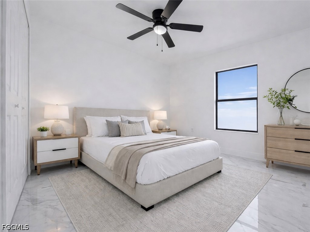 7644 19th Terrace LaBelle, FL 33935 - Photo 5 of 12 a bed room with bed and a closet
