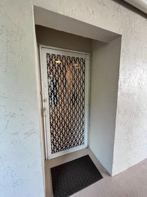 9569 West McNab Road, Unit 9569 Tamarac, FL 33321 - Photo 5 of 39 Screened door entry