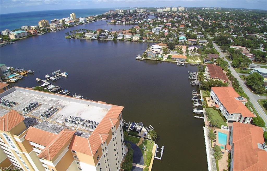 450 Launch Circle, Unit 203 Naples, FL 34108 - Photo 21 of 24 an aerial view of a house with a lake view