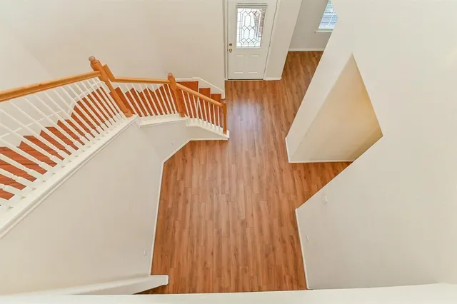 a view of staircase with wooden floor