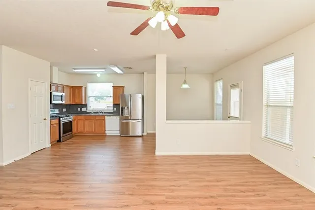 a view of kitchen with wooden floor