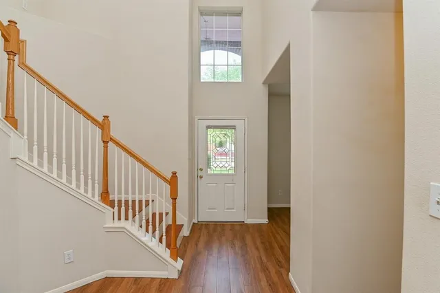a view of an entryway with wooden floor