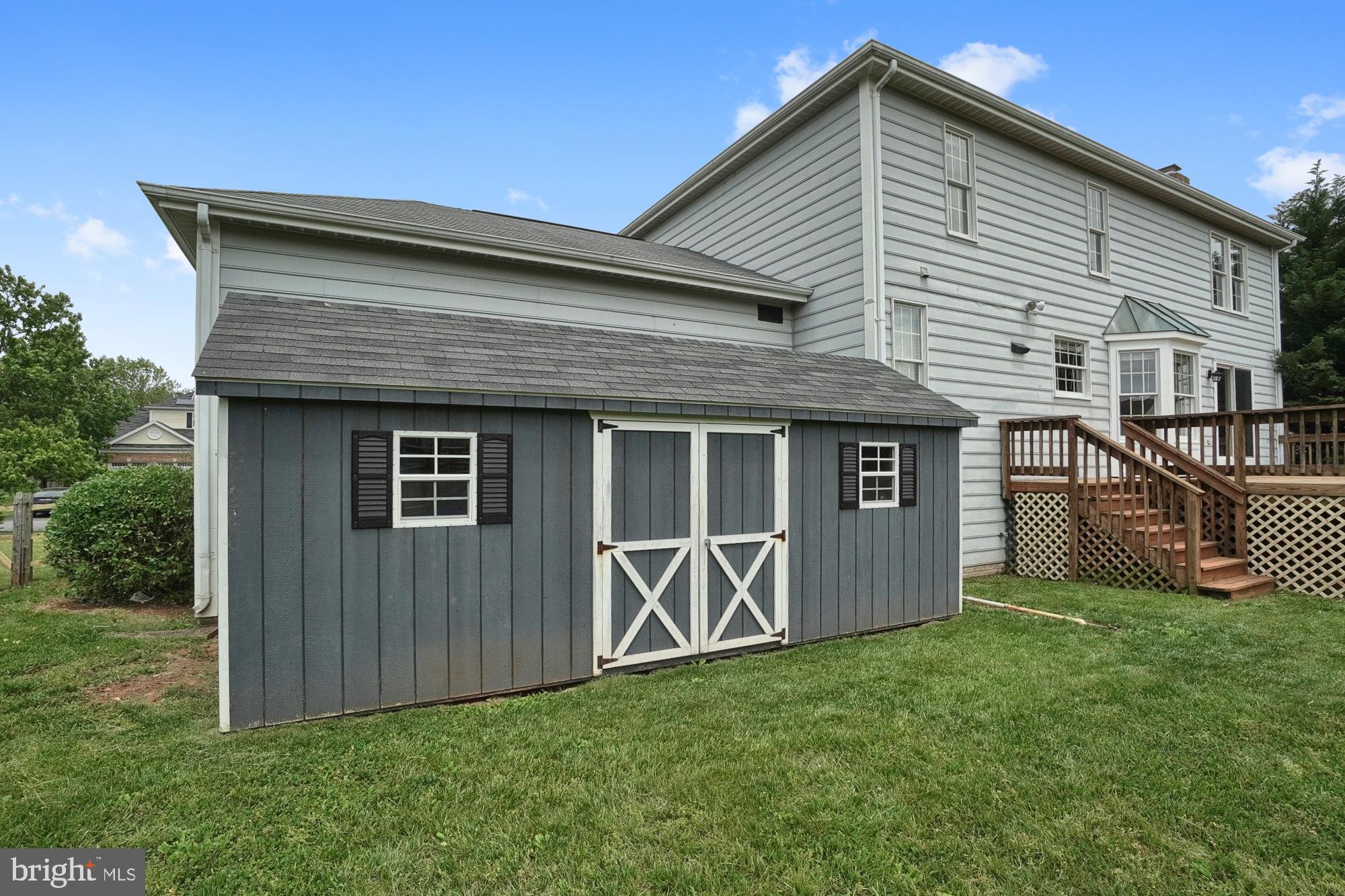 17205 Spates Hill Road Poolesville, MD 20837 - Photo 13 of 59 a front view of a house with yard