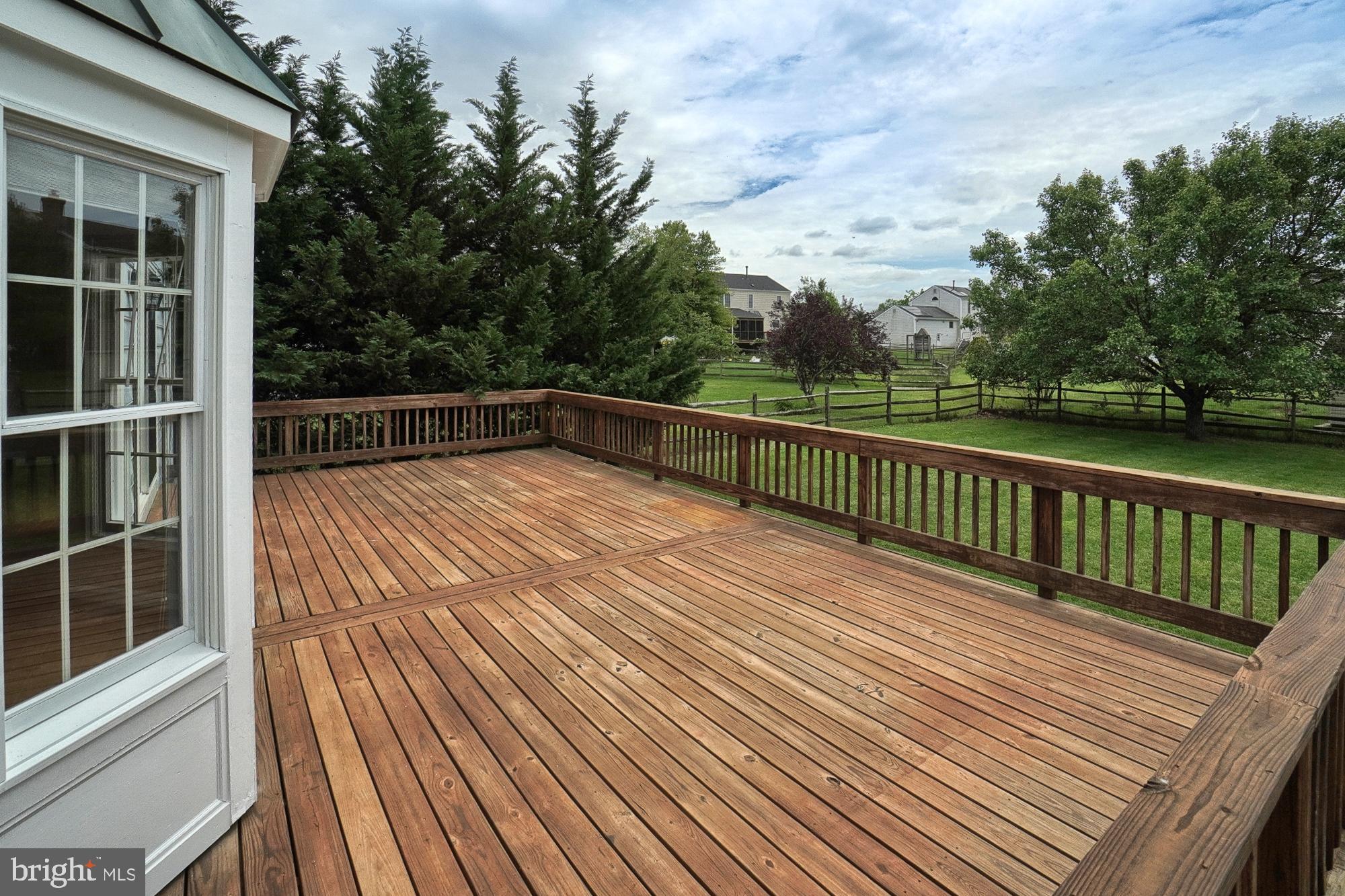 17205 Spates Hill Road Poolesville, MD 20837 - Photo 15 of 59 a view of balcony with wooden floor and fence