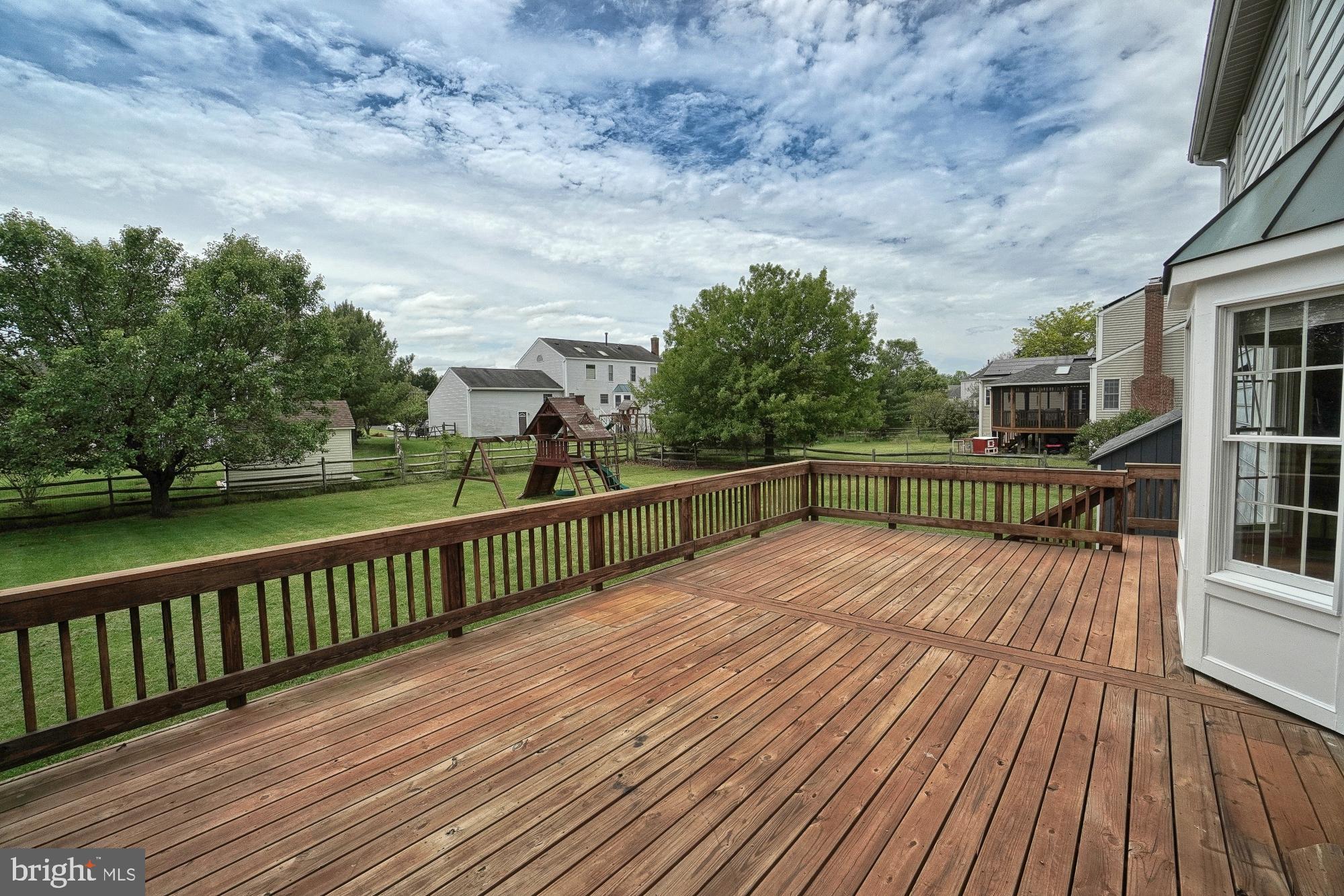 17205 Spates Hill Road Poolesville, MD 20837 - Photo 16 of 59 a view of balcony with wooden floor and fence