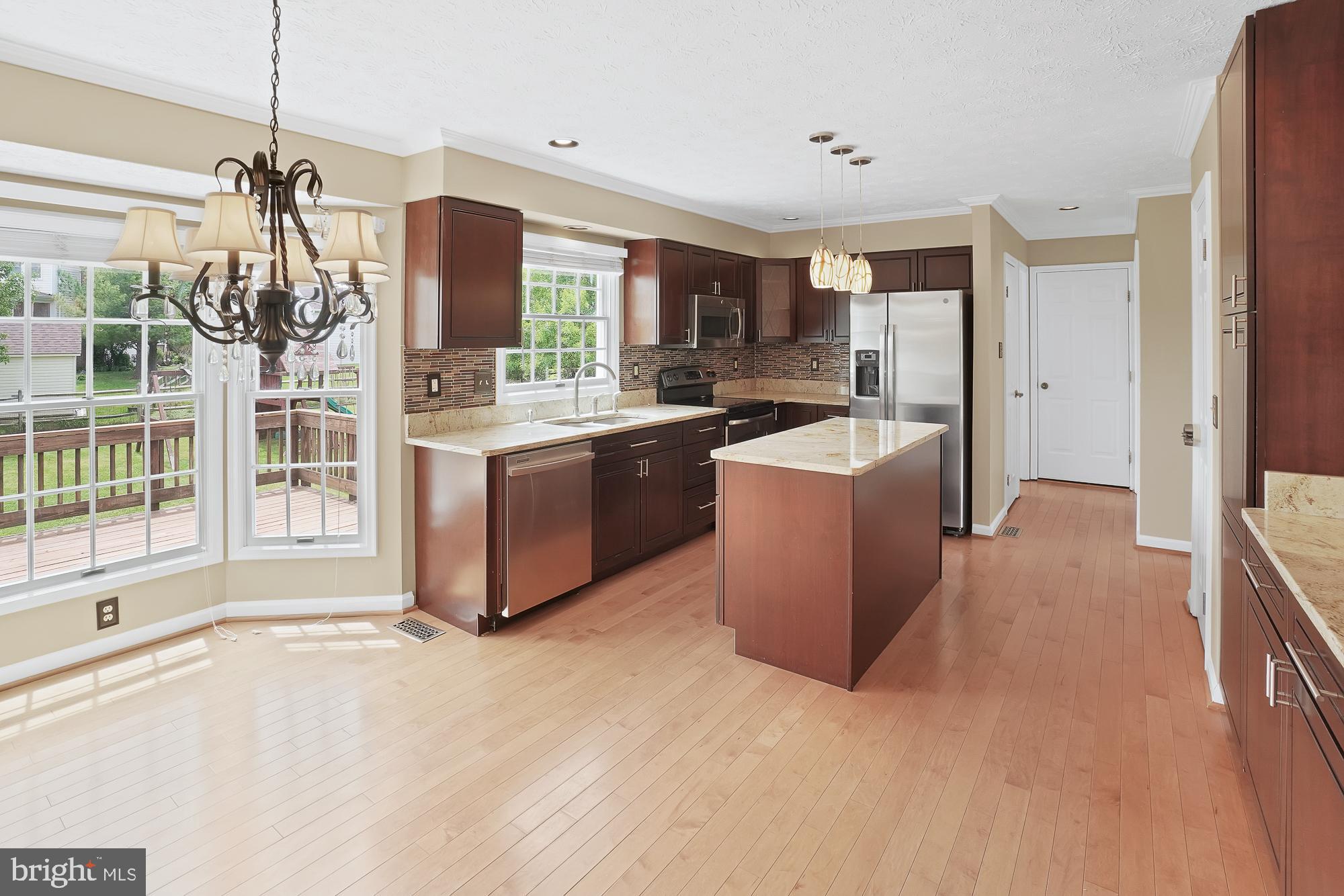 17205 Spates Hill Road Poolesville, MD 20837 - Photo 17 of 59 a large kitchen with a large window and stainless steel appliances