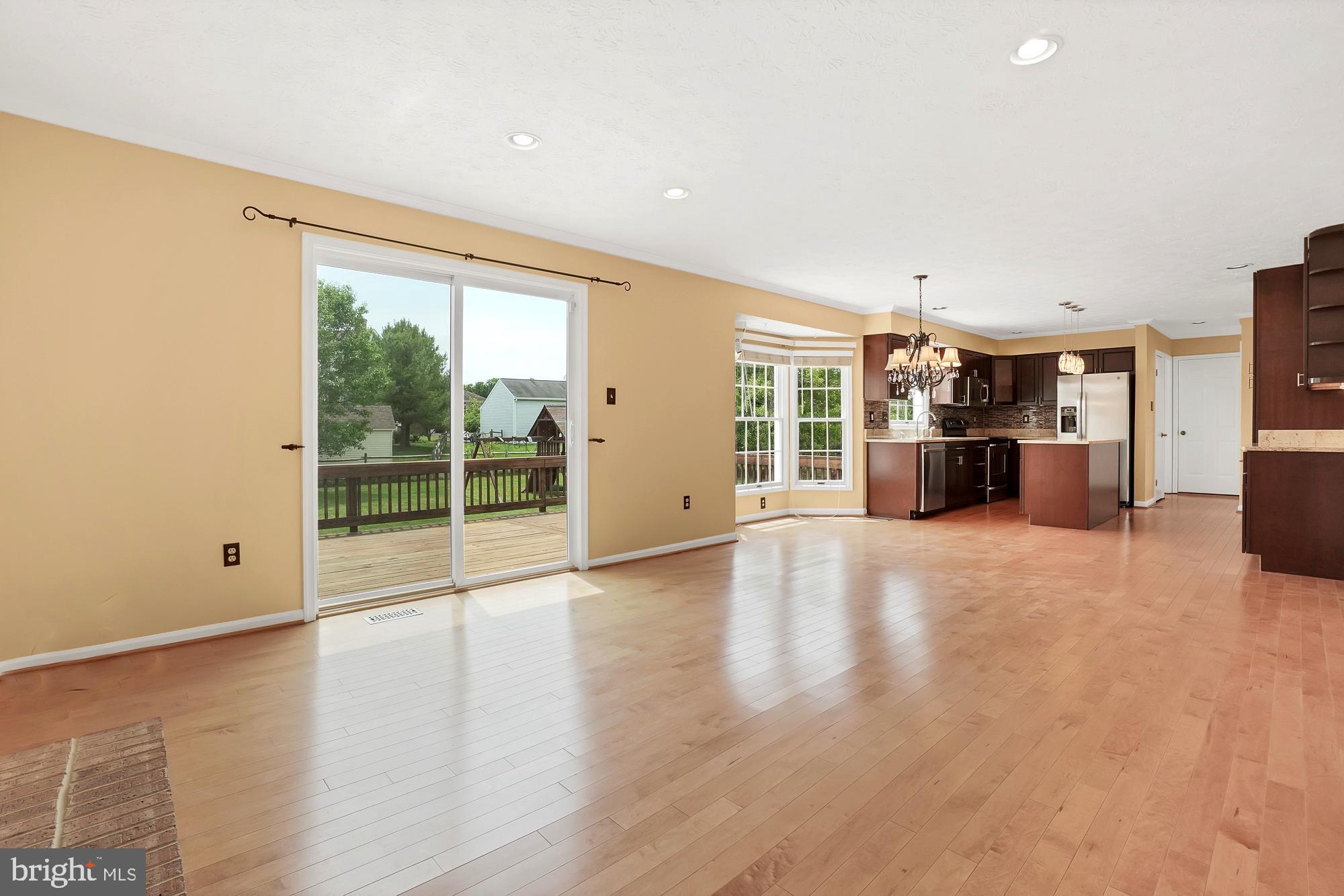 17205 Spates Hill Road Poolesville, MD 20837 - Photo 22 of 59 a view of empty room with wooden floor and windows