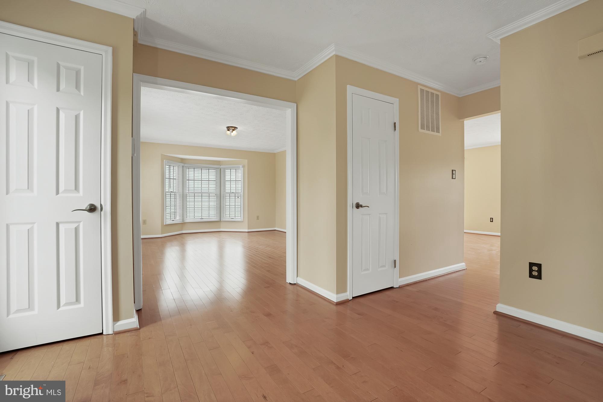 17205 Spates Hill Road Poolesville, MD 20837 - Photo 24 of 59 a view of an empty room with window and wooden floor