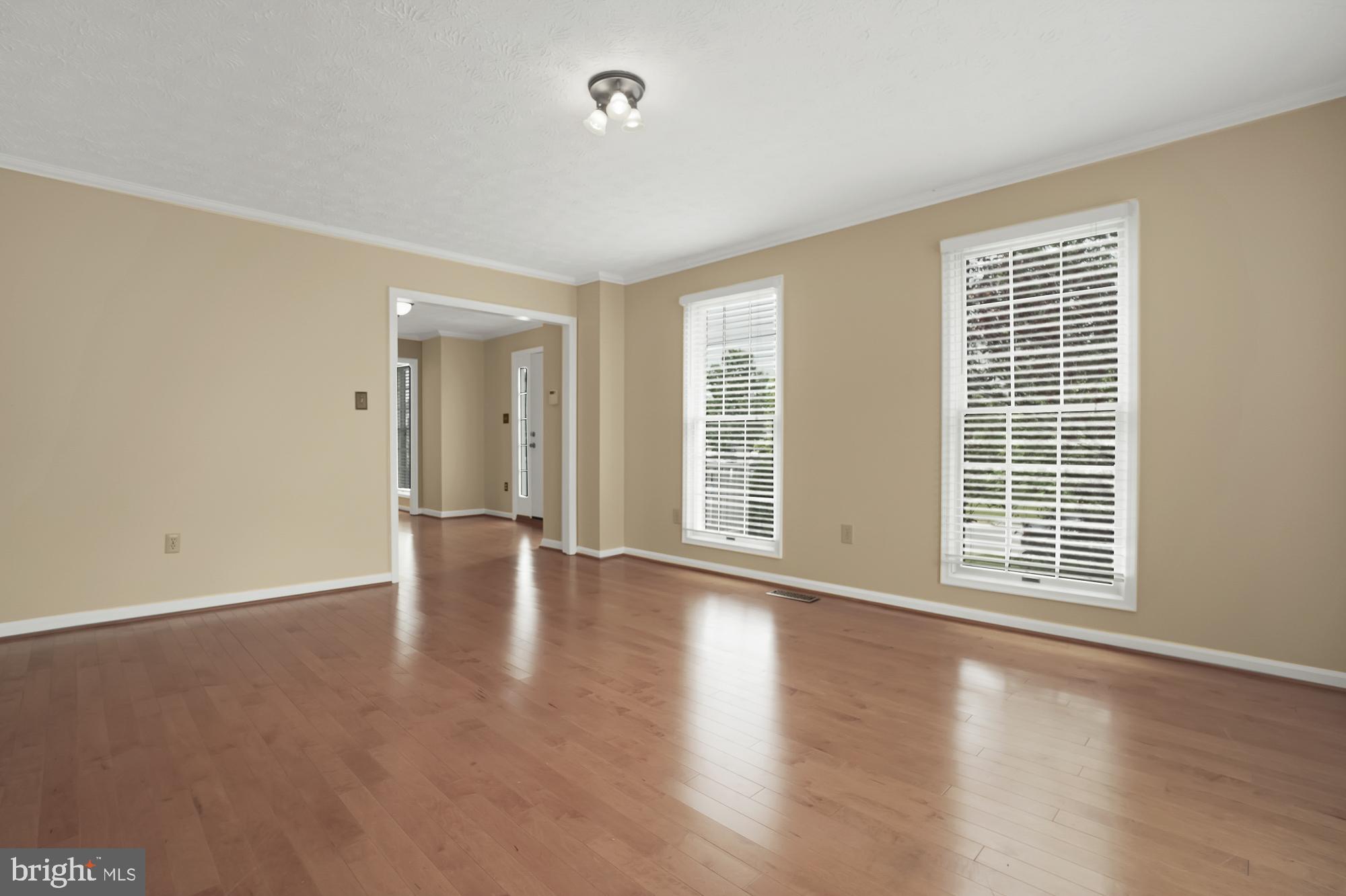 17205 Spates Hill Road Poolesville, MD 20837 - Photo 25 of 59 a view of an empty room with wooden floor and window