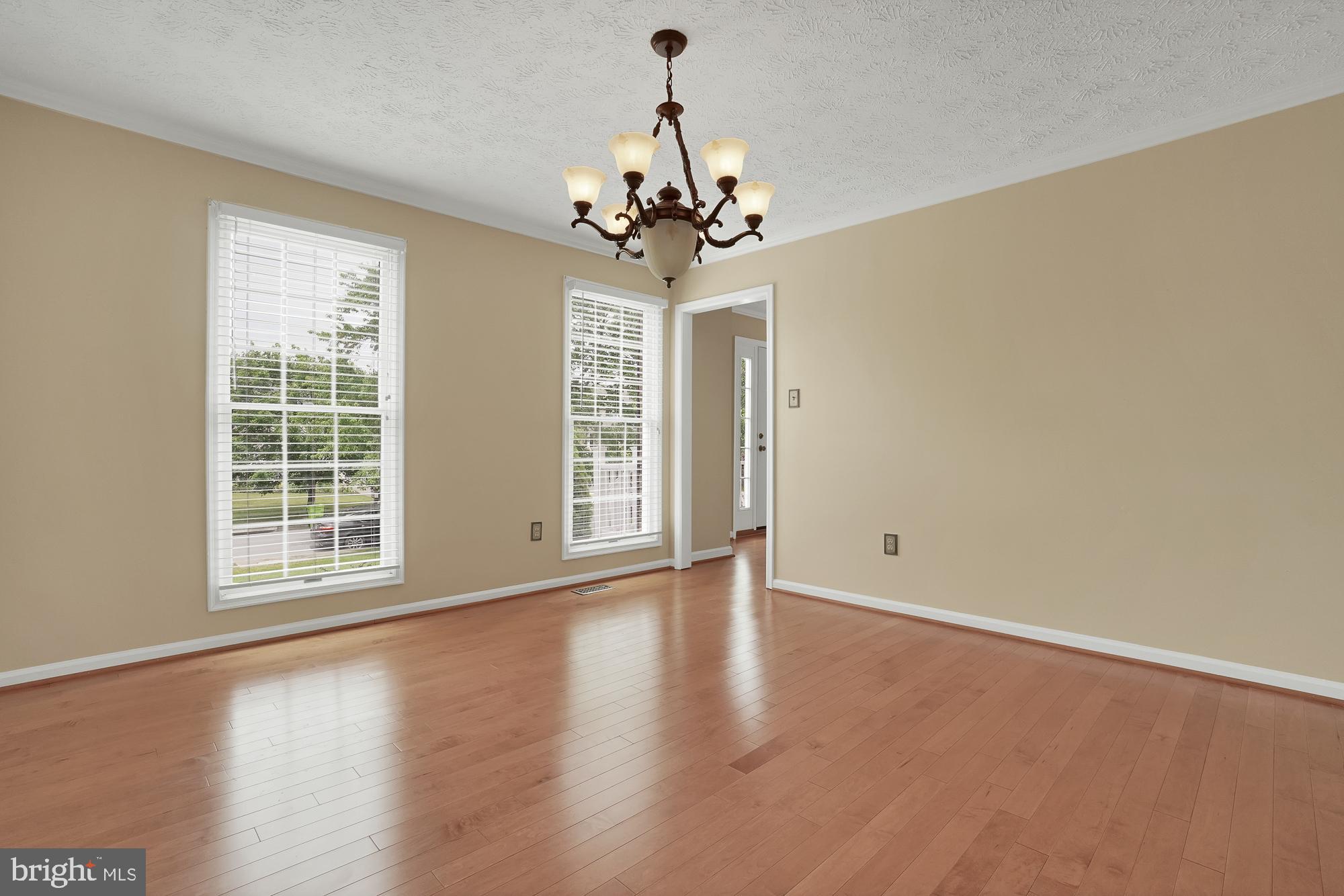 17205 Spates Hill Road Poolesville, MD 20837 - Photo 27 of 59 a view of an empty room with a window and wooden floor