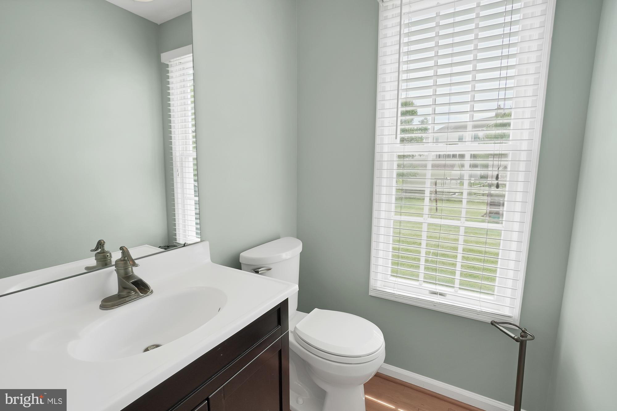 17205 Spates Hill Road Poolesville, MD 20837 - Photo 28 of 59 a bathroom with a sink and a toilet