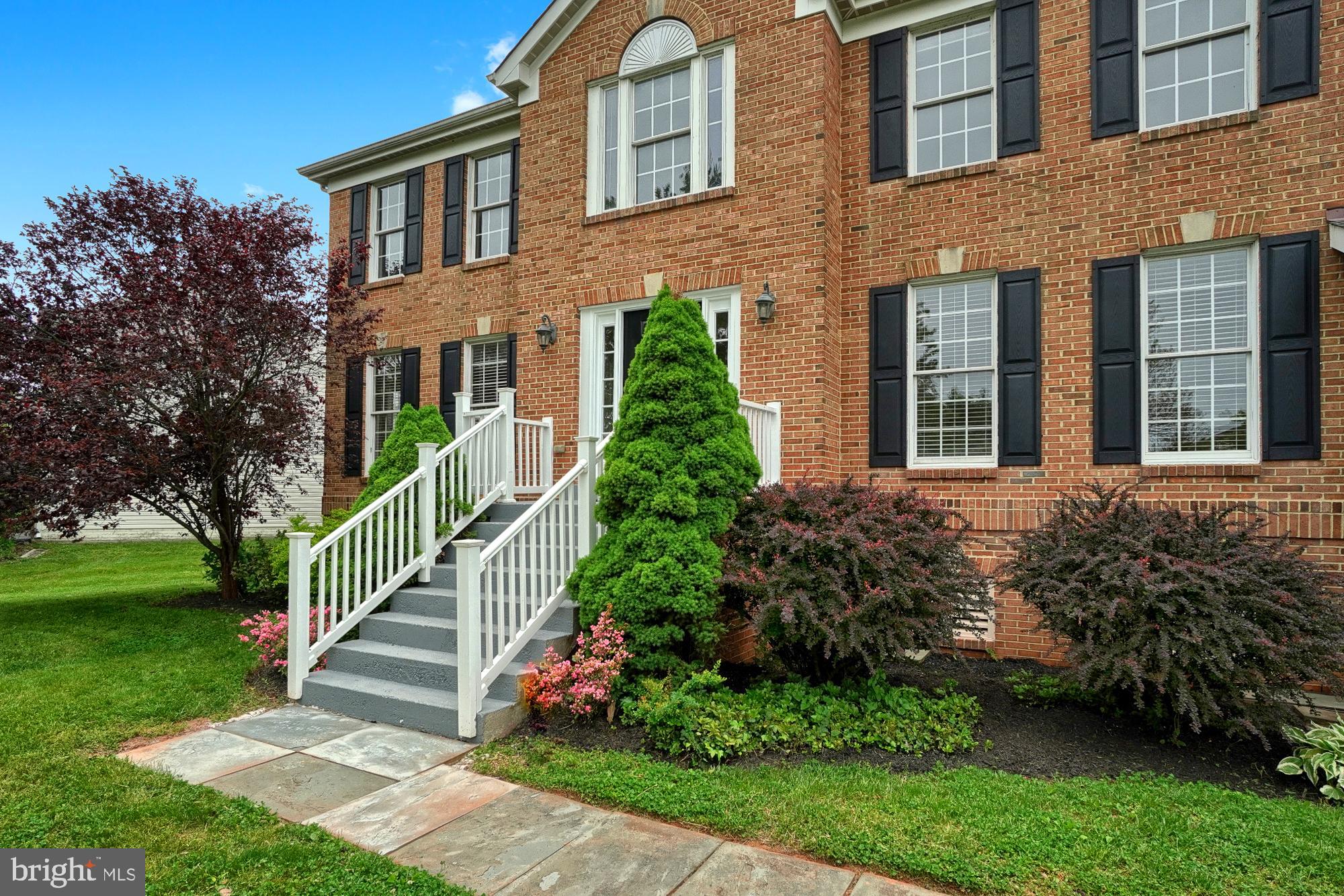 17205 Spates Hill Road Poolesville, MD 20837 - Photo 4 of 59 a front view of a house with a yard
