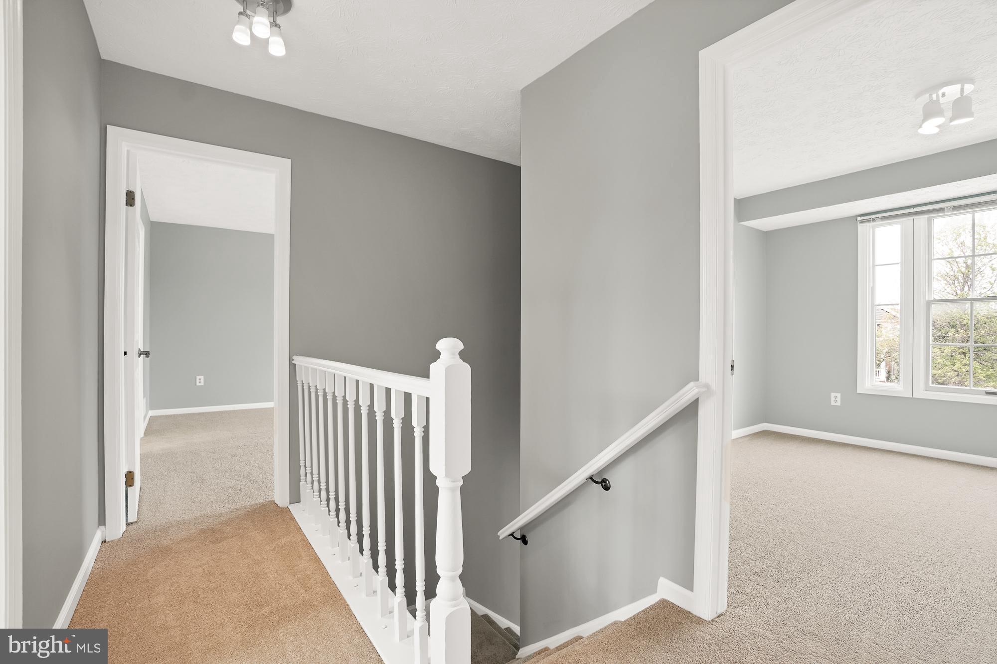 17205 Spates Hill Road Poolesville, MD 20837 - Photo 31 of 59 a view of a hallway with windows