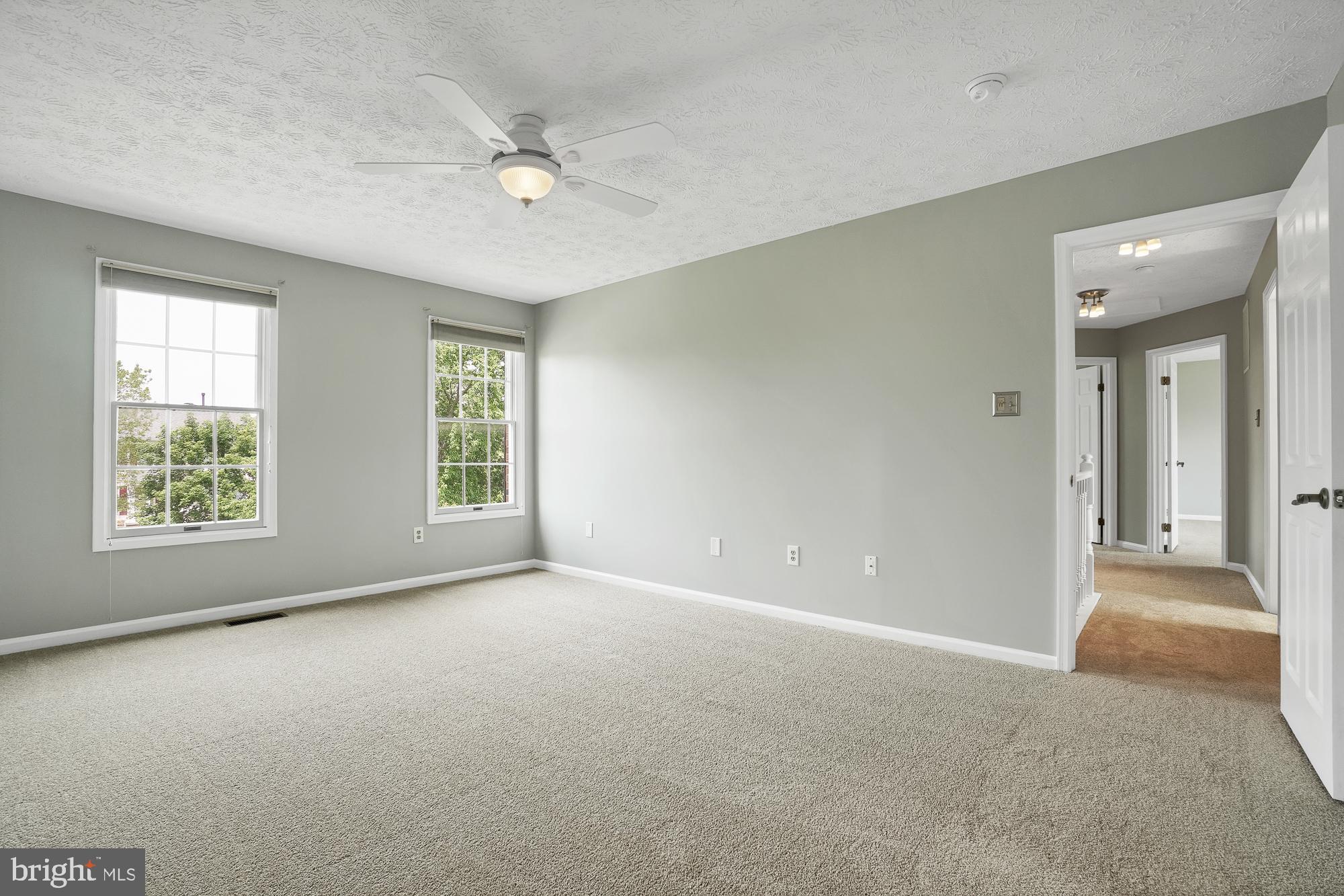 17205 Spates Hill Road Poolesville, MD 20837 - Photo 33 of 59 a view of a livingroom with a ceiling fan and window