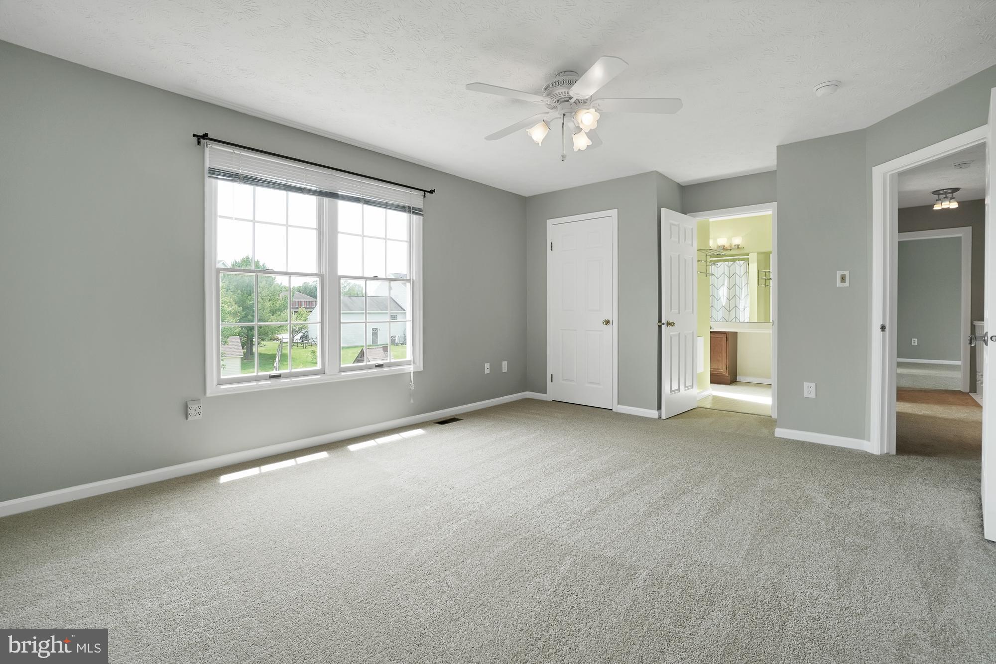 17205 Spates Hill Road Poolesville, MD 20837 - Photo 36 of 59 an empty room with windows and closet