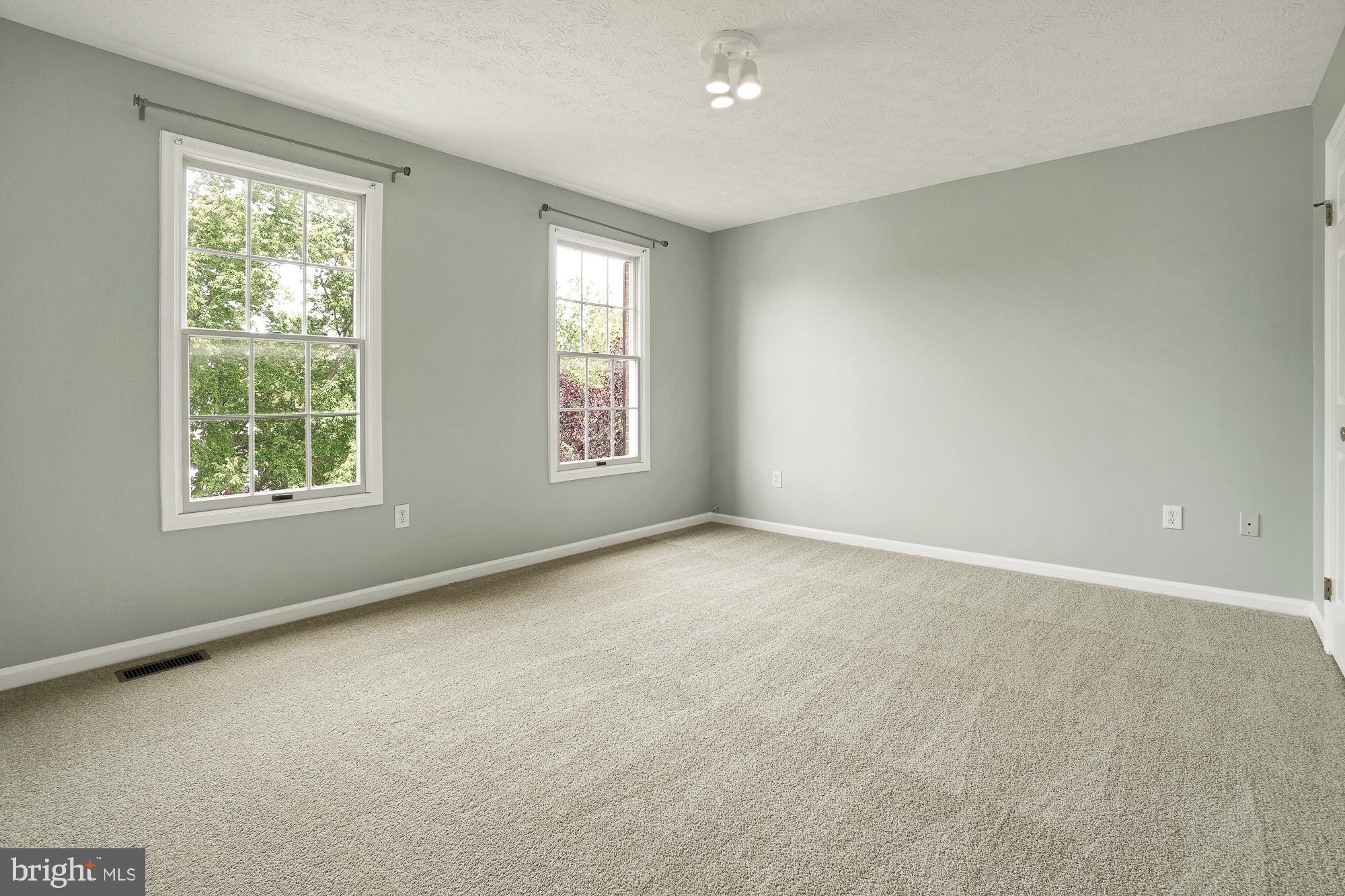 17205 Spates Hill Road Poolesville, MD 20837 - Photo 38 of 59 an empty room with windows