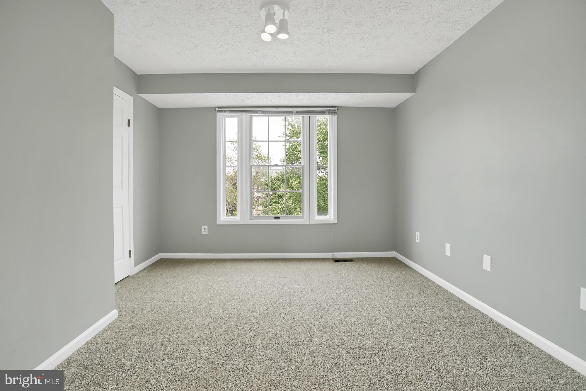 17205 Spates Hill Road Poolesville, MD 20837 - Photo 40 of 59 an empty room with windows