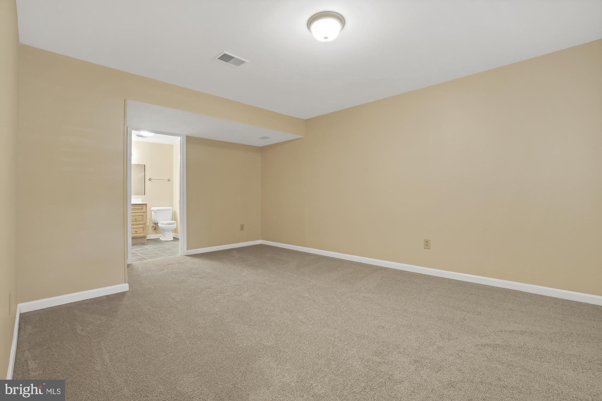 17205 Spates Hill Road Poolesville, MD 20837 - Photo 46 of 59 an empty room with a natural light