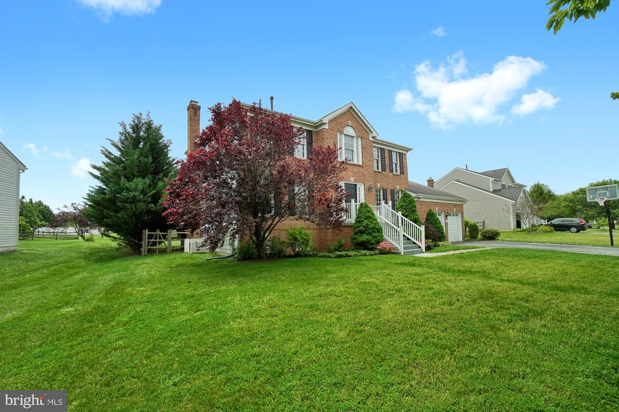 17205 Spates Hill Road Poolesville, MD 20837 - Photo 7 of 59 a front view of a house with a garden