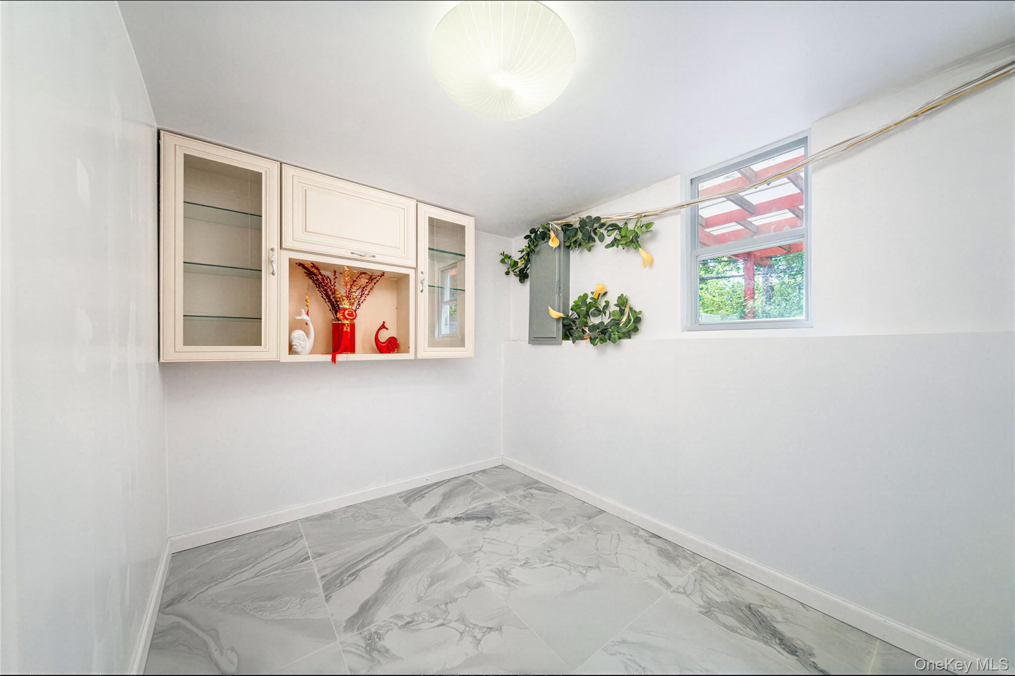 105 Seaman Road Jericho, NY 11753 - Photo 11 of 11 an entryway with window in it