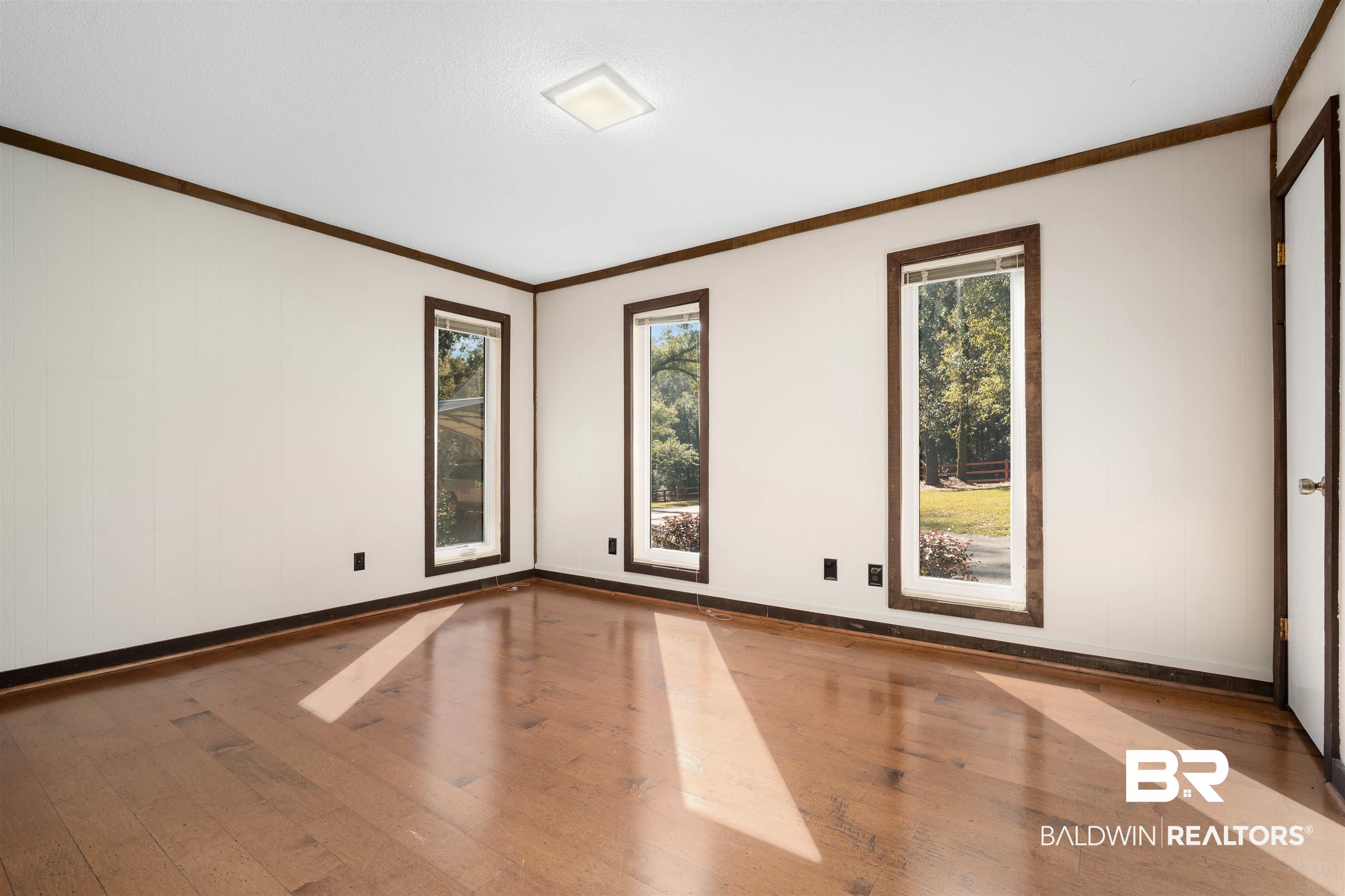 7912 Yorkhaven Road Mobile, AL 36695 - Photo 22 of 41 Unfurnished room with wood-type flooring and ornamental molding