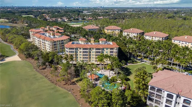 an aerial view of residential houses with outdoor space and river