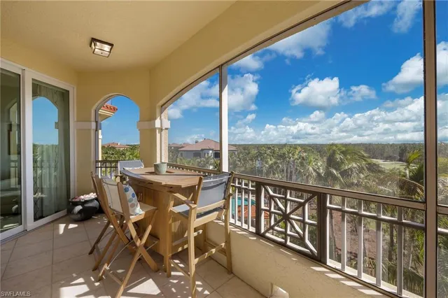 a bedroom with a bed and a tv