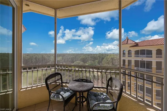 a bedroom with two beds and painting on the wall