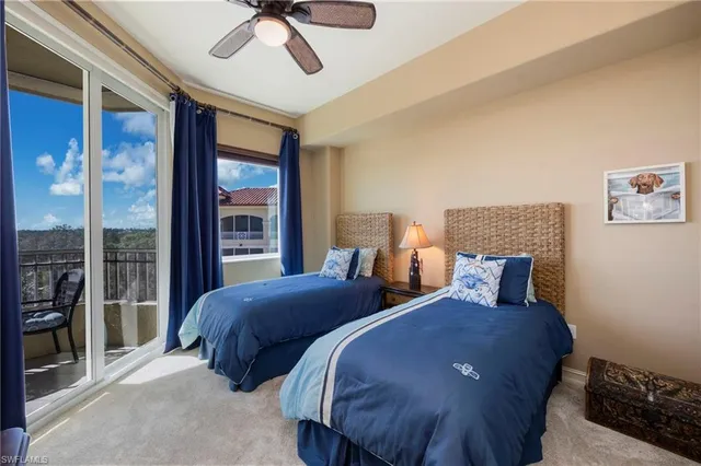 a bathroom with a granite countertop sink toilet and a mirror