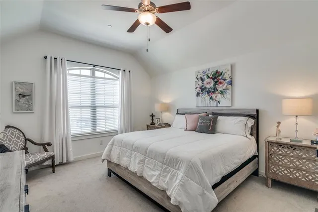 a view of a hallway to a livingroom with furniture