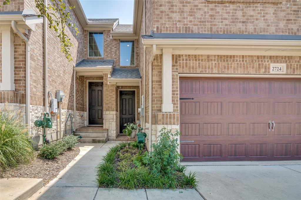 2724 Splendor Lane Little Elm, TX 75068 - Photo 2 of 25 a front view of a house with a garden
