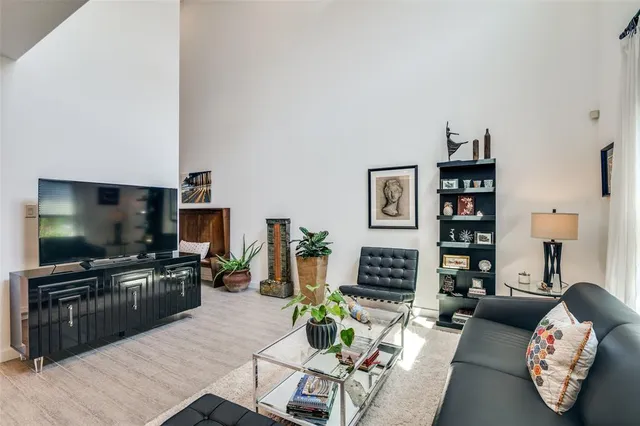 a living room with fireplace furniture and a flat screen tv