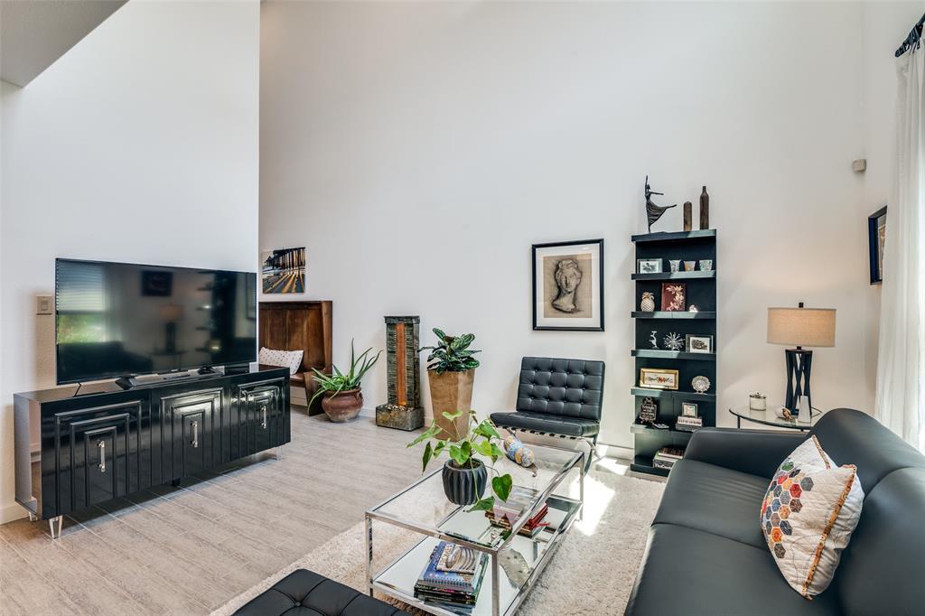 2724 Splendor Lane Little Elm, TX 75068 - Photo 4 of 25 a living room with fireplace furniture and a flat screen tv