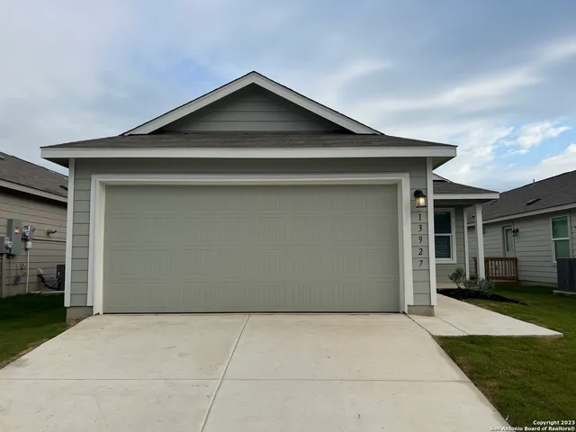 a front view of a house with a garage