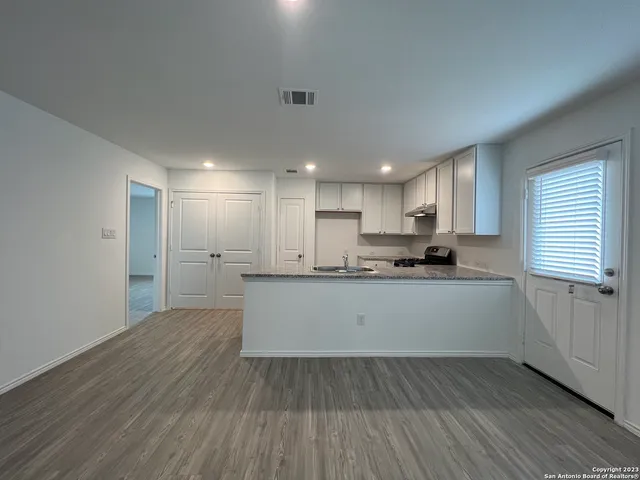 a view of kitchen with wooden floor