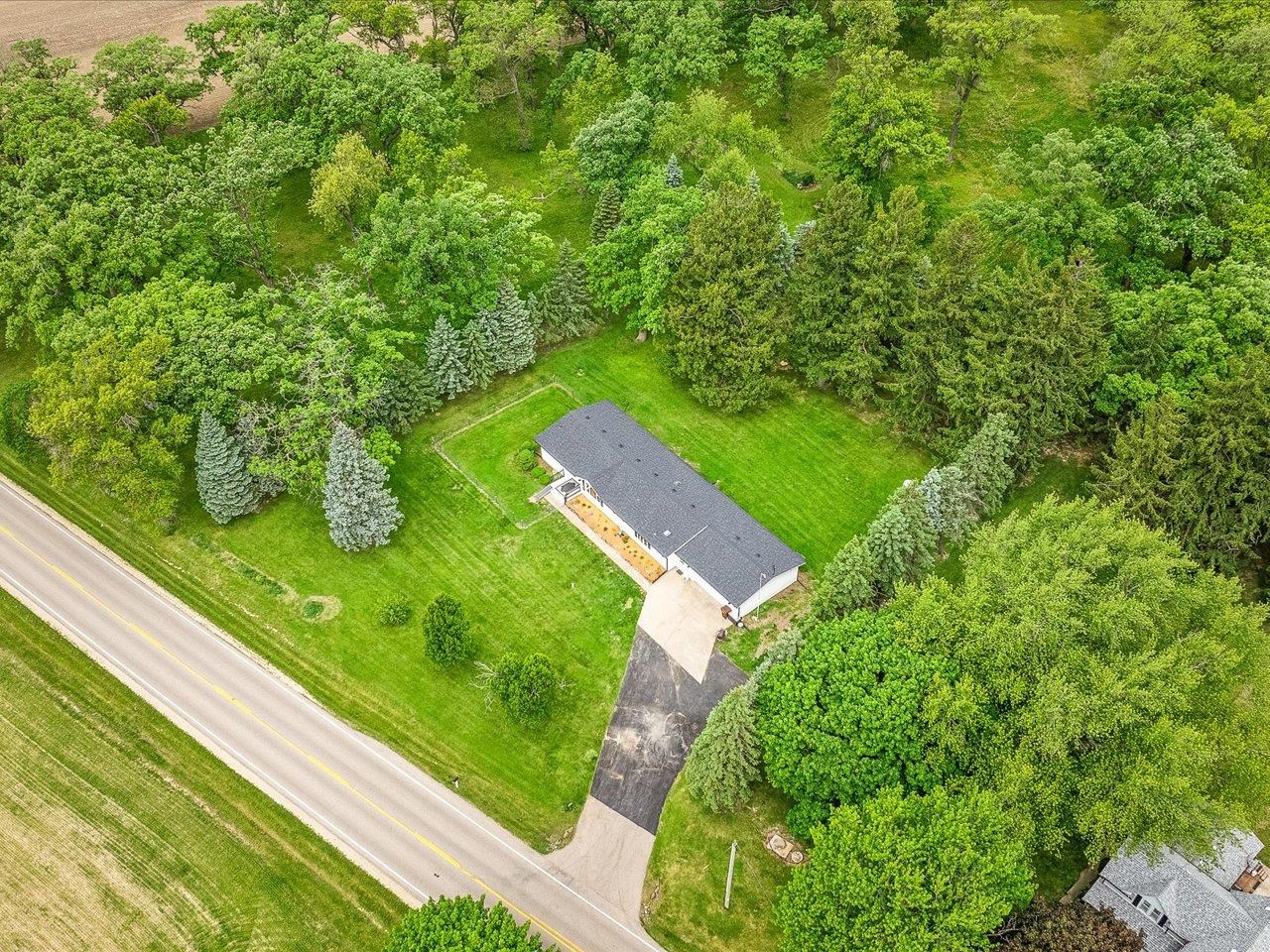 8500 Manchester Road Capron, IL 61012 - Photo 10 of 51 a view of a yard with potted plants