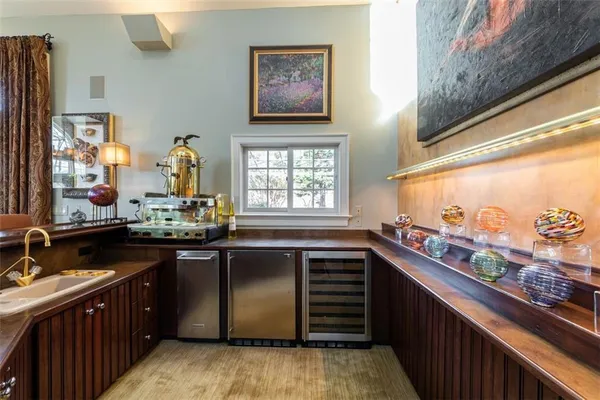 a kitchen with stainless steel appliances a sink stove and cabinets