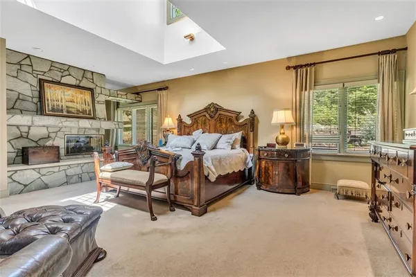 a bedroom with a bed and a couch