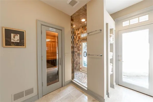 a view of a bathroom with a glass door