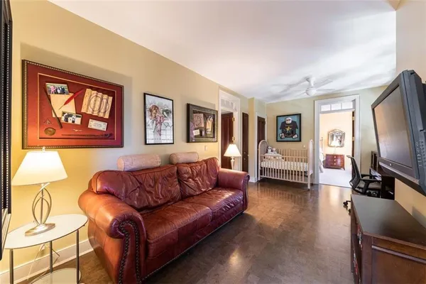 a bedroom with a bed and ceiling fan