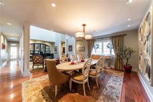 a view of a dining room with furniture window and wooden floor