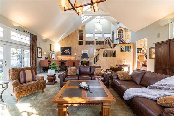 a living room with furniture fireplace and flat screen tv